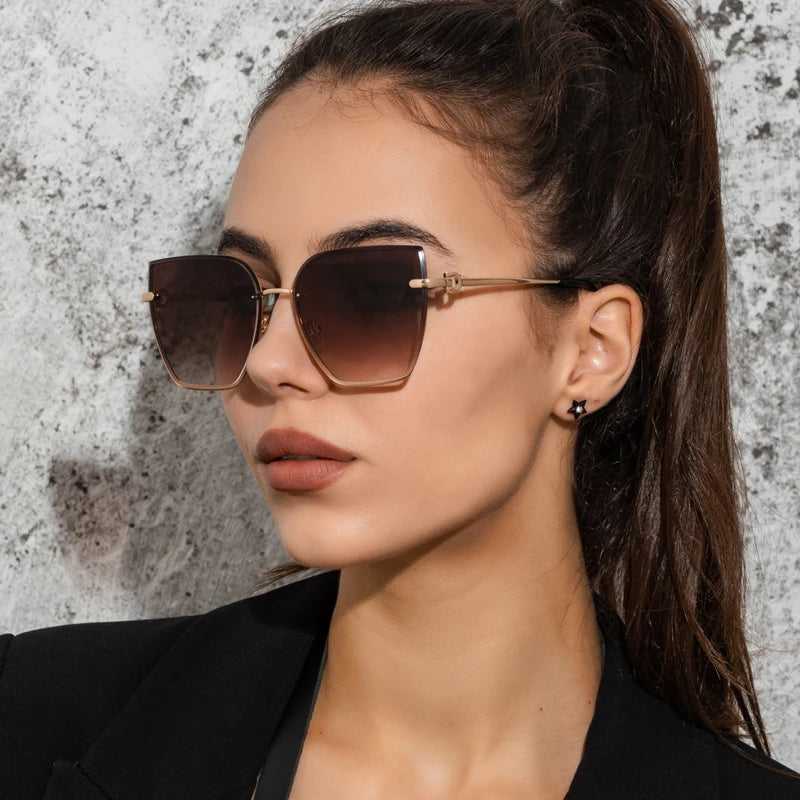 Chic Frameless Cat Eye Sunglasses for Women - Designer Gradient UV400 Shades with Alloy Frame.